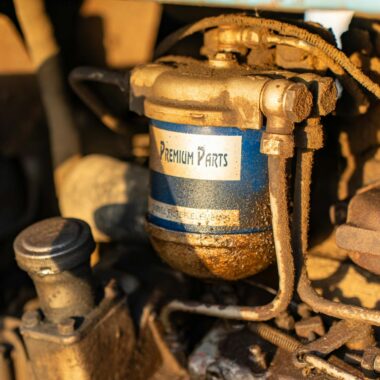 Detailed view of a mechanical engine part with Premium Parts label.